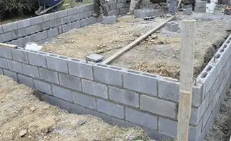 Professionals building a foundation with blocks in Lowell, MA