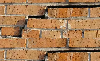 Brick wall with serious structural damage in Lowell, MA